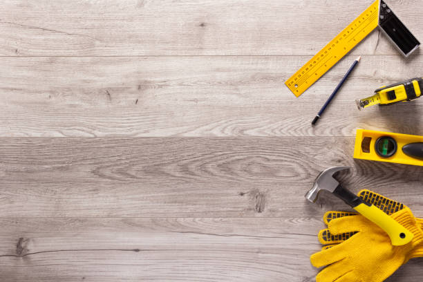 istock Wood laminate background and tools on floor texture. Wooden laminate 1404212849
