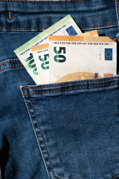 istock euro banknotes in jeans back pocket (vertical) 1404212917