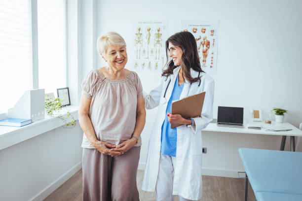 istock Doctor and patient standing in doctor's office 1404212947