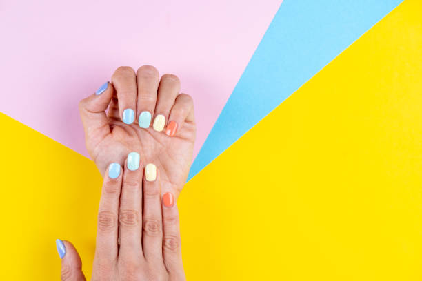 istock Pastel nail manicure, different color nails, summer vibes. 1404213924