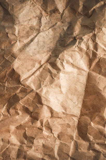 istock Parcel paper as background texture. Recycling concept with brown paper heap 1404215042