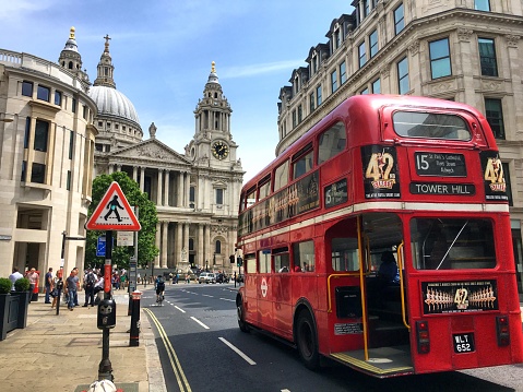England, London, double decker bus blurring through city streets.