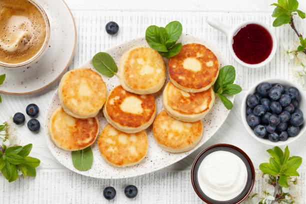 istock Cottage pancakes with jam, sour cream and berries 1404218152