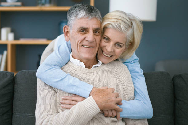 istock Woman hugging her husband at home 1404218170