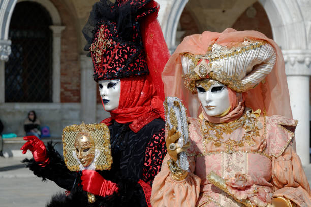 Veneto region, Venice, Italy - March 21, 2010 - Venetian Masquerade in souvenir shop with Palazzo Ducale (Doges Palace) on Piazza San Marco (Saint Mark square).