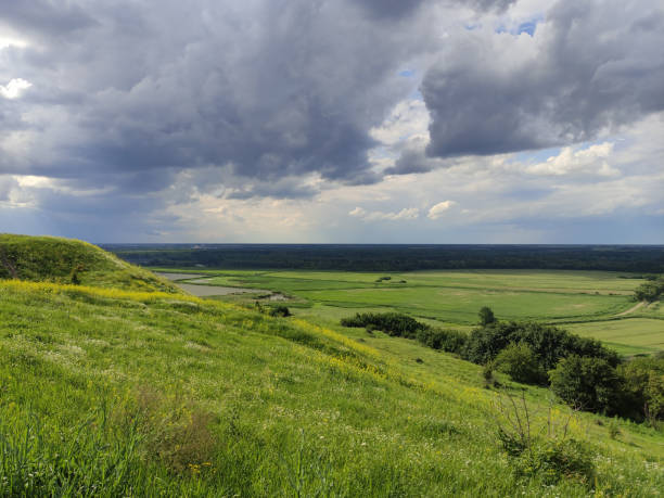 istock Beautiful mountain meadow and clouds in the sky 1404222417
