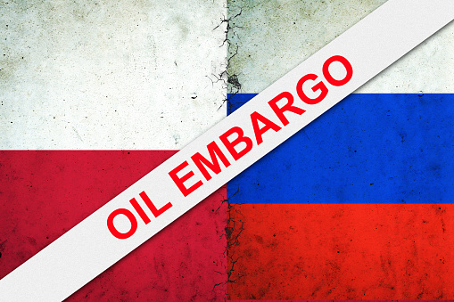 Oil embargo. Flags of Poland and Russia. Refusal of Russian oil. Sanctions. Politics. Economy.Background.