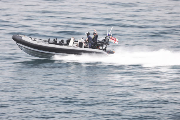 Gibraltar 06/16/2022: Two customs officers speeding along patrolling the waters around Gibraltar. Panning with motion blur