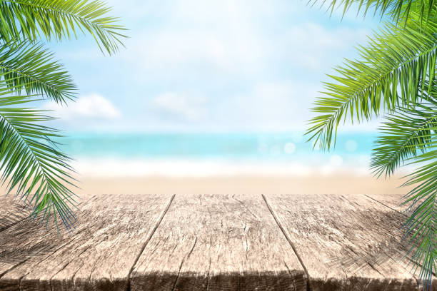 istock Wood table over sea and beach background in summer day. 1404223400