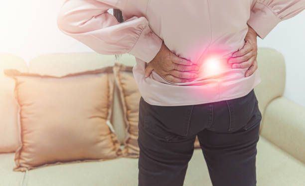 istock Close up older woman suffering from backpain 1404223729