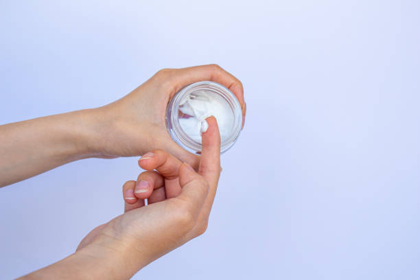 istock Woman hand with moisturizing cream isolated on white background. 1404224008