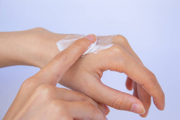 istock Woman hand with moisturizing cream isolated on white background. 1404224519