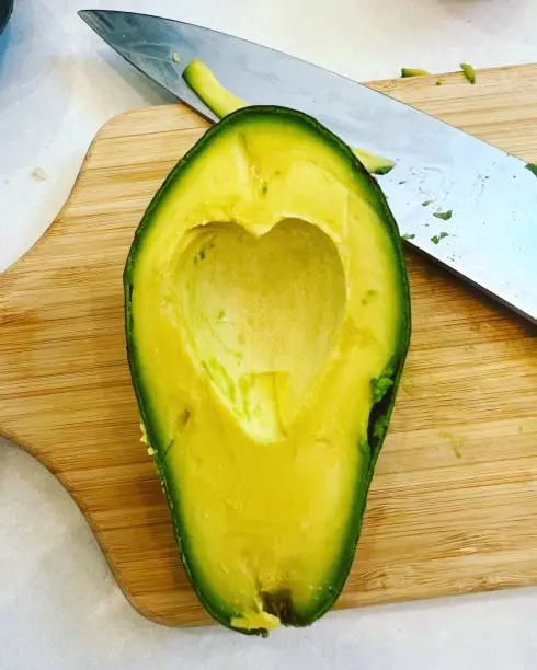 Freshly cut avocado shaped like a heart