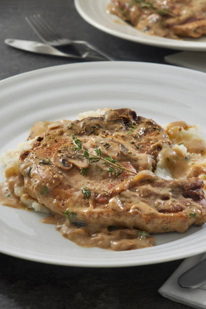 istock Braised Pork Chops in Creamy Mushroom Sauce 1404226938