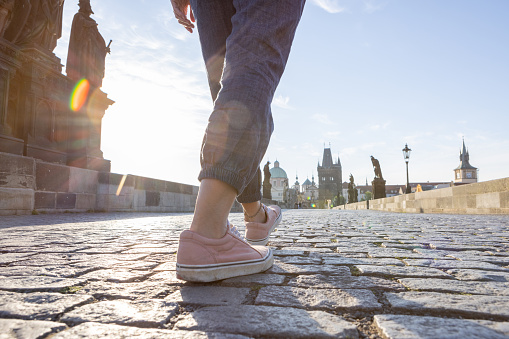 Solo travel woman exploring the city and the famous landmark. \nPrague, Czech Republic