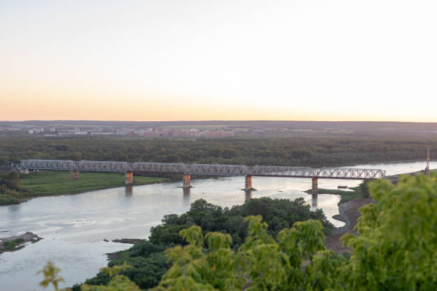 istock Railway bridge over river on morning sunrise sky. Sunset over Ufa, Bashkortostan, Russia. 1404227029