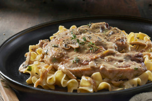istock Braised Pork Chops in Creamy Mushroom Sauce 1404227033