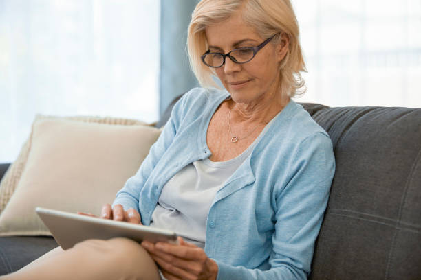 istock Woman going through her finances on her Ipad 1404227608