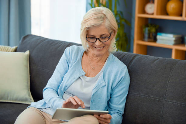 istock Woman going through her finances on her Ipad 1404227609