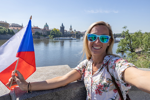 Solo travel woman exploring the city and the famous landmark. \nPrague, Czech Republic