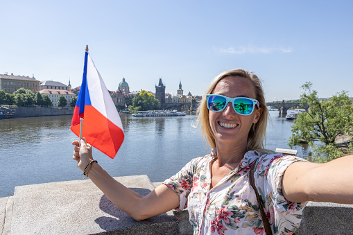 Solo travel woman exploring the city and the famous landmark. \nPrague, Czech Republic