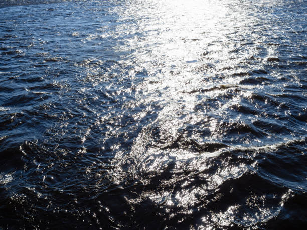 istock sun glare on water surface of Great Neva river 1404230866