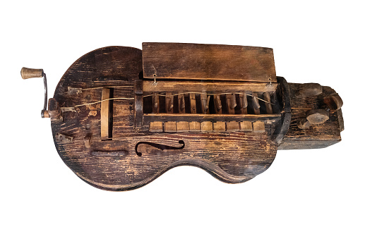 antique wooden hurdy-gurdy cutout on white background