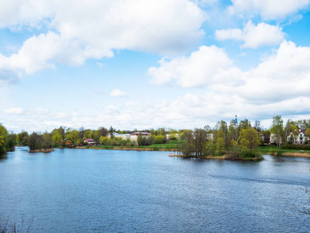 istock white clouds in blue sky over lake in Gatchina 1404234909