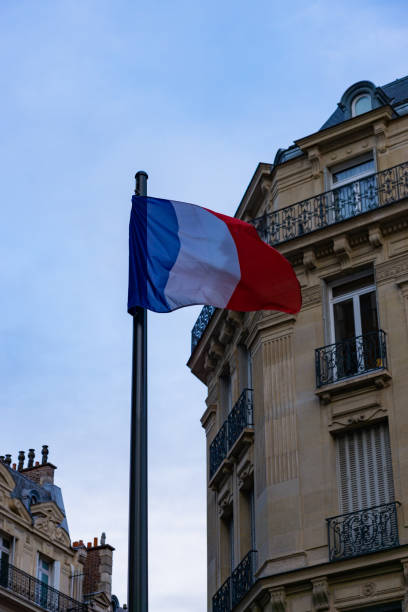 istock French flag in the windy street 1404235927