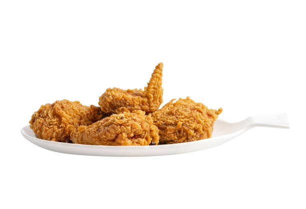 istock Fried chicken served on white plate isolated on white background, Junk food high calorie 1404237007