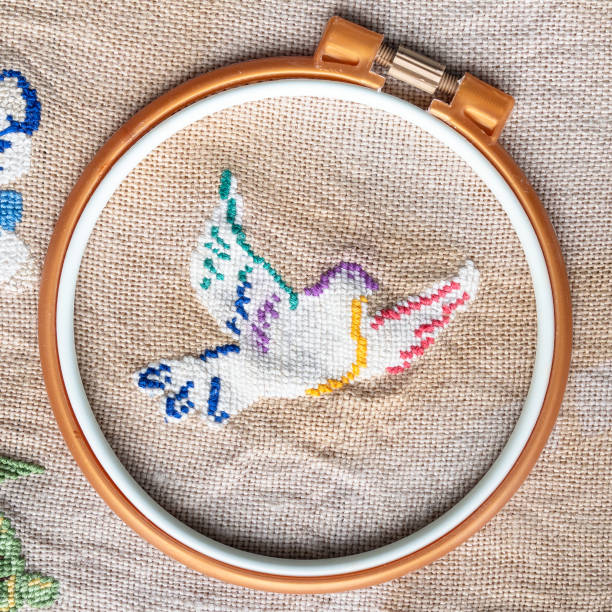 istock flying pigeon in plastic hoop embroidered by hand 1404237274