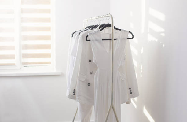 istock female white capsule summer wardrobe in  white room 1404239094