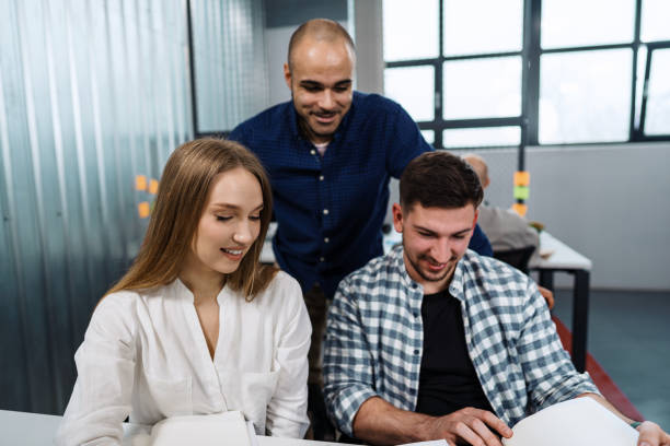 istock Group of young business people working in office 1404239827
