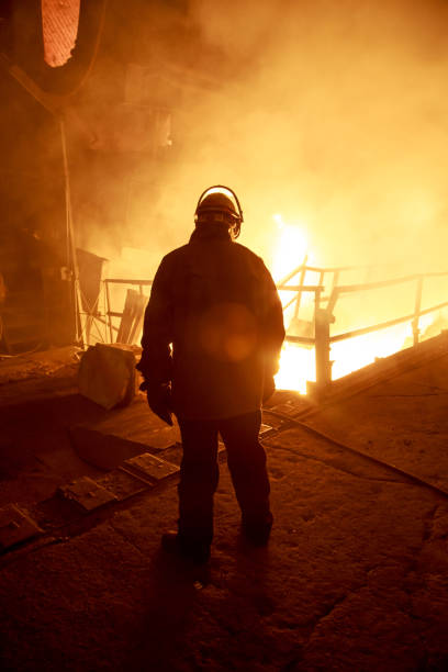 istock Steel foundry worker at blast furnace workshop. 1404241968