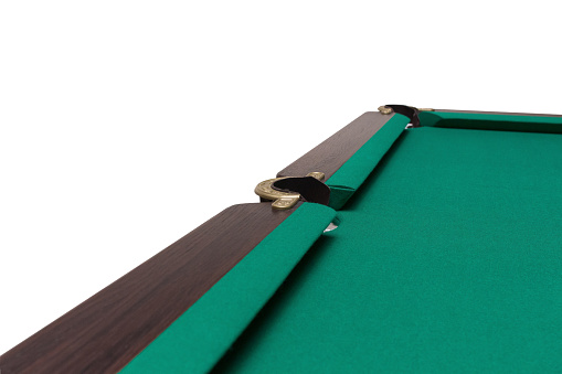 A pool table. Parts of a billiard table close-up. American pool table. Billiard pockets. Wooden billiard table.