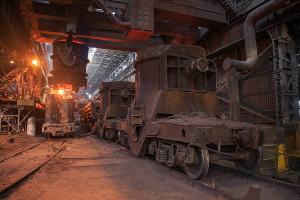 istock Steel pouring from casting ladle into metal molds. 1404244926