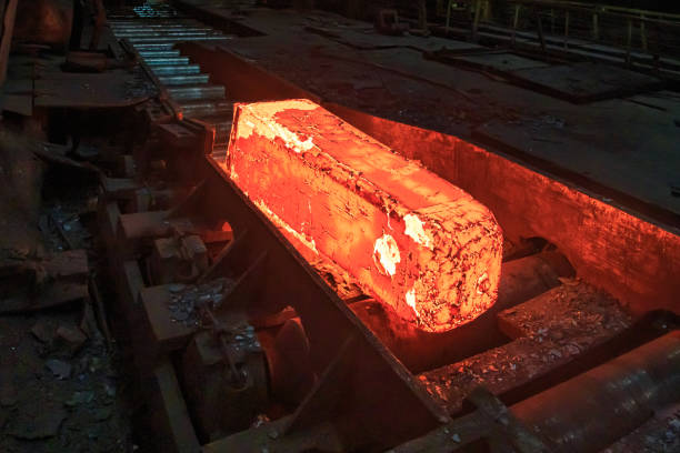 istock Hot red steel slabs in iron foundry workshop. 1404245037