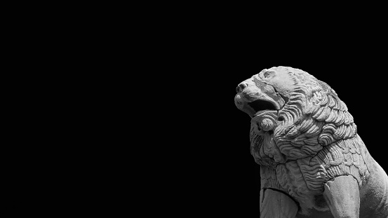 Sculptures of two lions statues isolated on white. Exterior of the Cathedral of San Lorenzo (St. Lawrence) XII-XIV century in Genova, Liguria, Italy, Europe