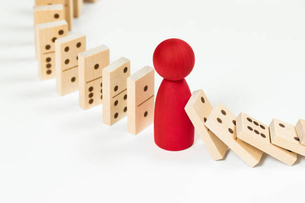 istock one red human figure and domino blocks 1404245712