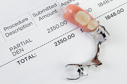 Dental insurance statement for partial dentures.