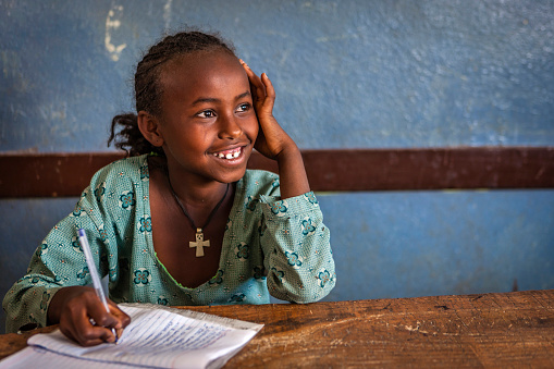 African little girl during her english class
