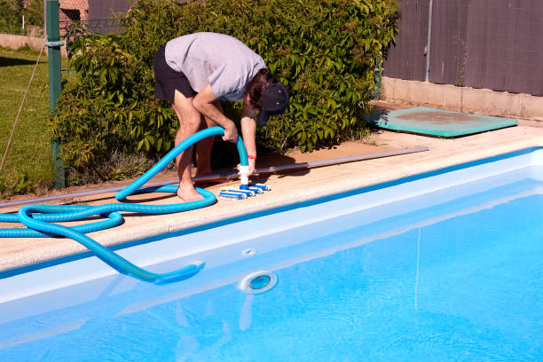 istock A young pool cleaner is getting ready to start cleaning. 1404249113