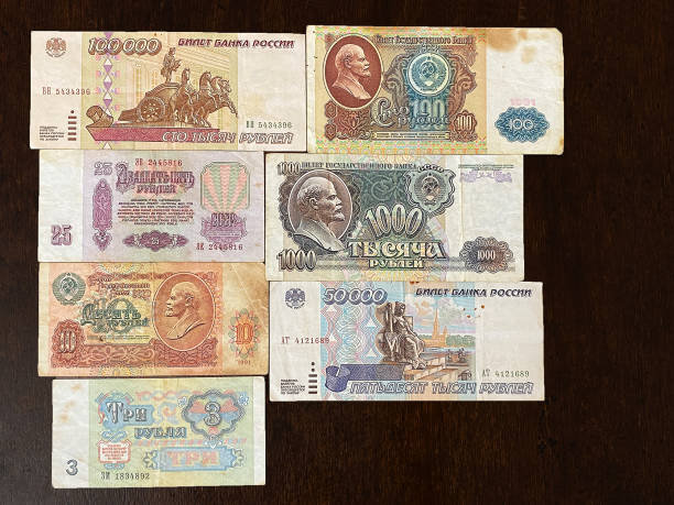 istock Old Soviet banknotes in denominations of three, five, twenty-five, fifty, one hundred rubles on a dark background. Finance concept 1404250076