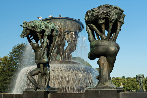 Oslo, Norway - May 30, 2022: Frogner Park fountain with sculptures created by Gustav Vigeland.