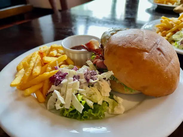 Photo of Cheese burger with fries and salad