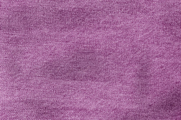 istock Texture of purple jeans. purple background. Denim 1404255694