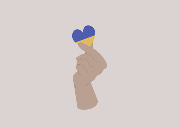 ilustraciones, imágenes clip art, dibujos animados e iconos de stock de una mano sosteniendo un corazón coloreado como una bandera ucraniana, apoyo a ucrania - ukraine war