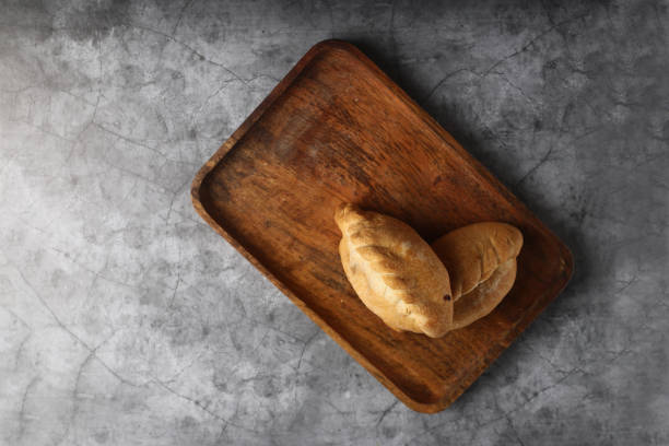 istock bukens on a wooden plate isolated on gray background flat lay 1404255917