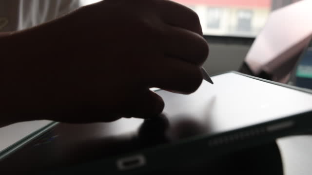 Electronics pen writing on digital tablet screen