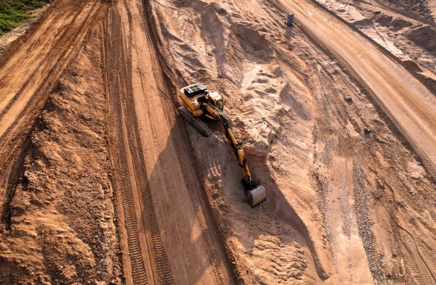 istock Excavator dig ground at construction site. Earthmover  on road construction. Heavy equipment and machinery. 1404260803